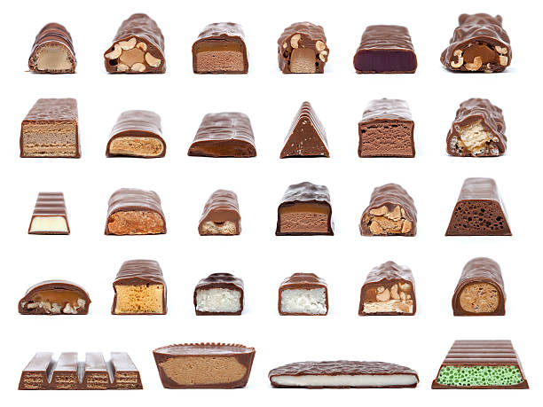 What's in the center of a chocolate bar? A collection of 28 chocolate bar cross-sections showing what is inside isolated on white. stuffed stock pictures, royalty-free photos & images
