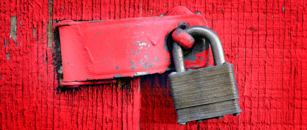istock Lock on Hinge on Red Door and Wall 1479437047
