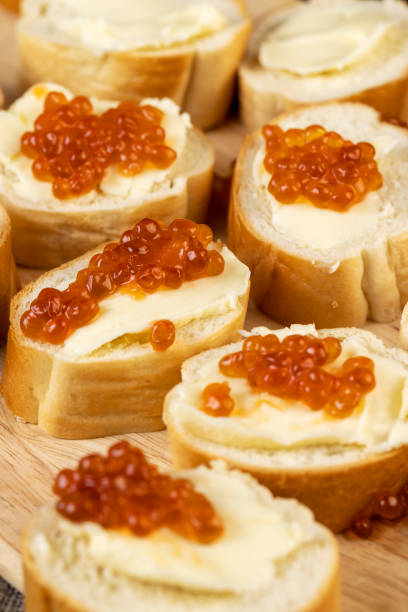 istock Thinly sliced baguette with salmon caviar and butter 1479438983