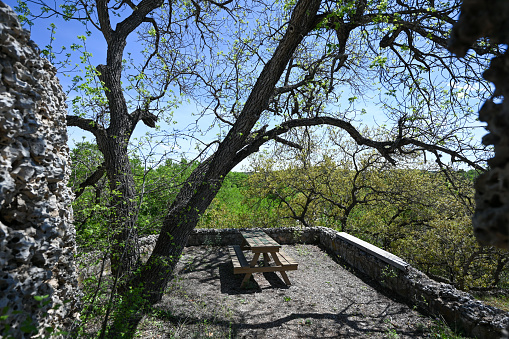 Picnic table located near karst rock during springtime