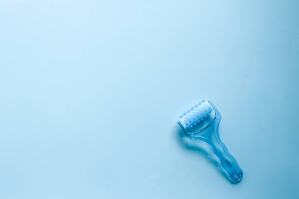 istock Top view plastic hand massager on blue background 1479449211