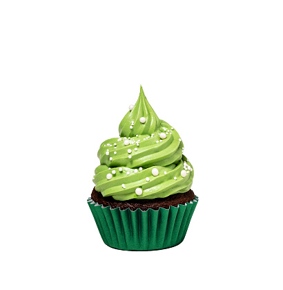 cupcake with green buttercream icing and sprinkles isolated on a pure white background