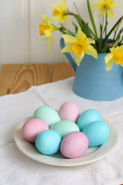 istock Easter eggs and daffodils on the table, a cottage festive composition. 1479452384
