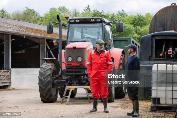 Taking A Break On The Farm Stock Photo - Download Image Now - Farmer, Tractor, Coveralls