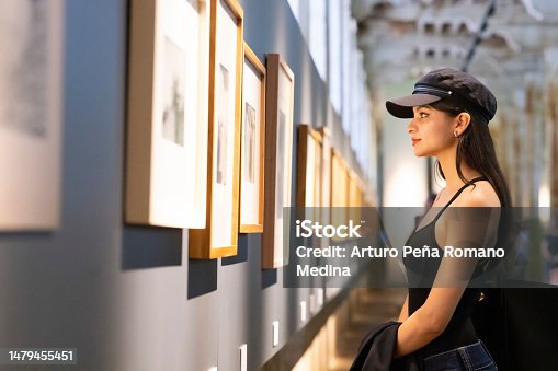 istock Young woman appreciating works of art 1479455451