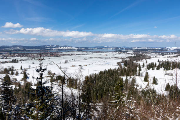 Schwangau, Hohenschwangau, Allgaeu, Bavaria Germany; into the snow covered landscape around the Forggensee and Bannwaldsee