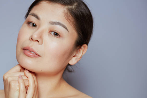 istock young asian woman on blue 1479455836