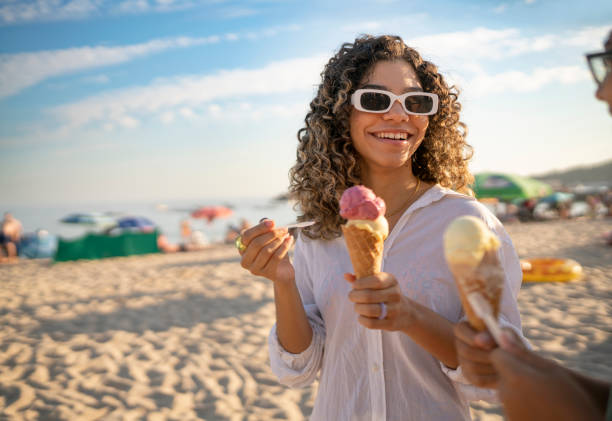 istock People eating ice cream on the beach 1479456073