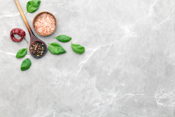 Culinary border of basil, salt, pepper