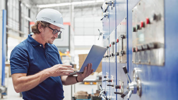 Professional Engineer checking quality control, and Manufacturing Operations stock photo