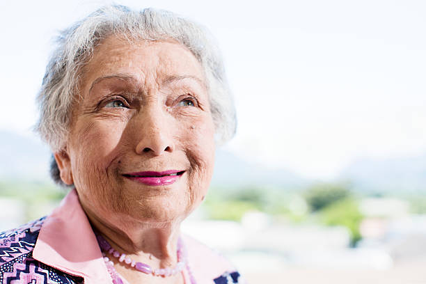 istock Serene old woman smiles, perhaps remembering something 147946142