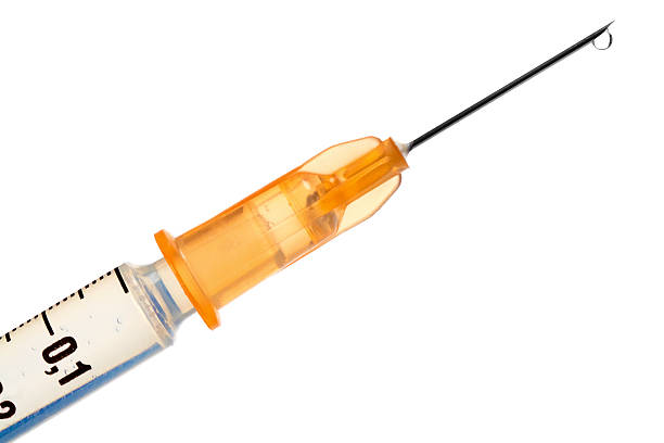 Hypodermic syringe and needle on white background stock photo