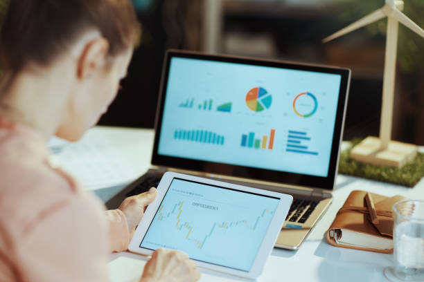 istock female using tablet PC and analysing business investment market 1479467721