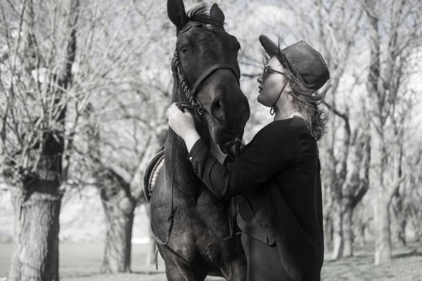 istock Woman bonding with her horse 1479467842