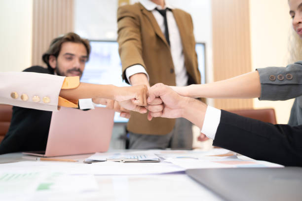 istock Businesspeople can motivate each other by joining hands. 1479468472