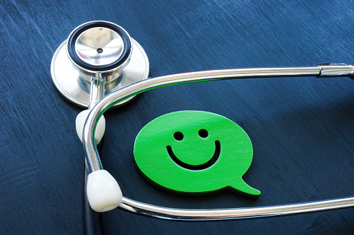 Positive patient experience concept. A Stethoscope and smiley.