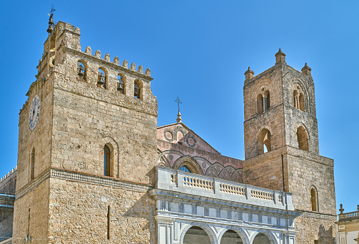 Monreale, Italy, the main facade of the Cathedral of Santa Maria Nuova also known as the Duomo of Monreale,