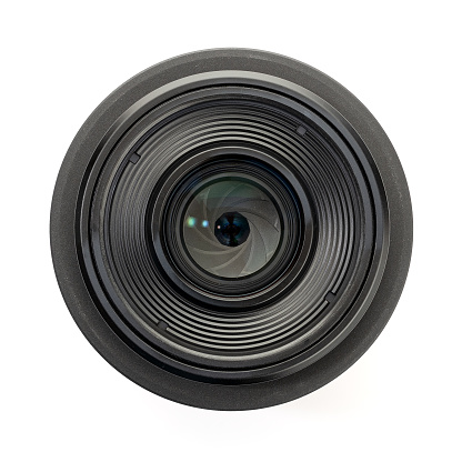 A modern high quality camera lens, with light reflected in the multicoated glass.