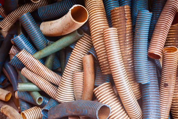 A pile of cut plastic corrugated multi-colored hoses.
