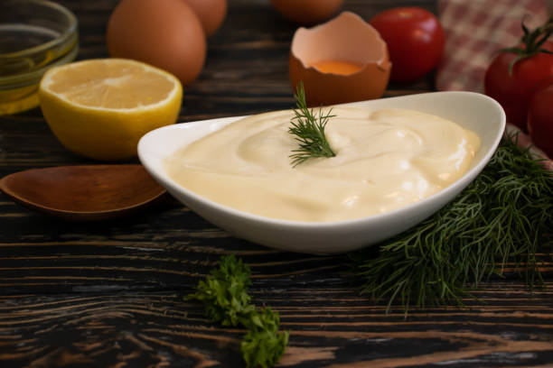 istock Homemade mayonnaise on old background 1479488263