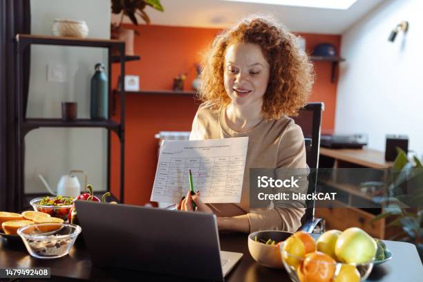 A Female Dietitian Recommending Healthy Nutrition Plan To A Client Stock Photo - Download Image Now