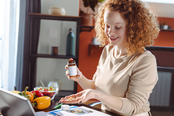 A female nutritionist talking on a video call with a client
