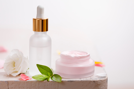 Fresh organic moisturizer and face serum bottle with gold dropper