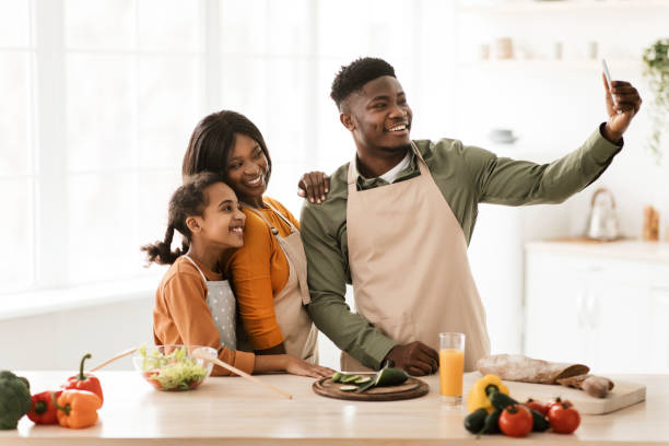 istock Black Family Making Selfie While Cooking Preparing Dinner In Kitchen 1479494185