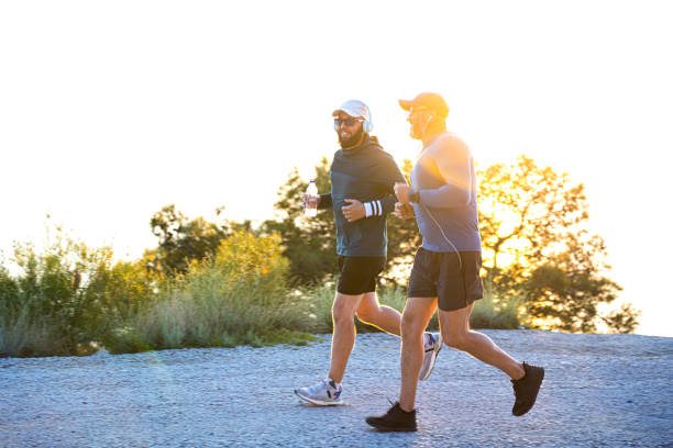istock Two man jogging in mountains at sunset 1479494925