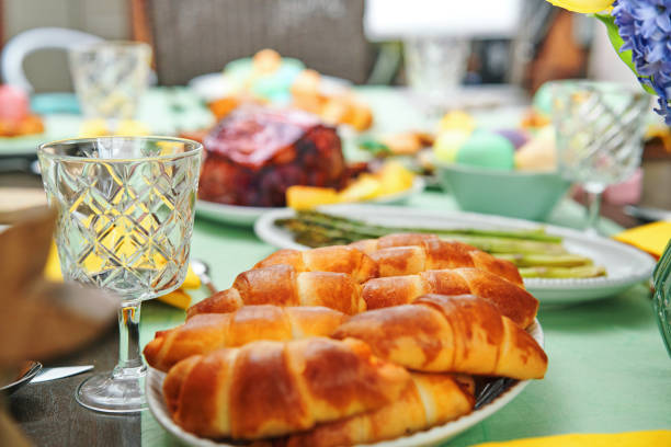 istock Easter Lunch with Roast Pork, Vegetables, Easter Cookies and Easter Cake 1479497367