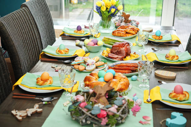 istock Easter Lunch with Roast Pork, Vegetables, Easter Cookies and Easter Cake 1479497411