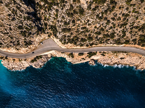 Winding road in the mountains. Drone point of view. Shoot directly above.
