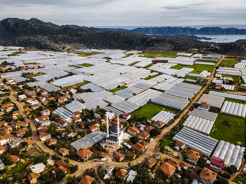 Drone view of greenhouse and small village. Agriculture in Turkey