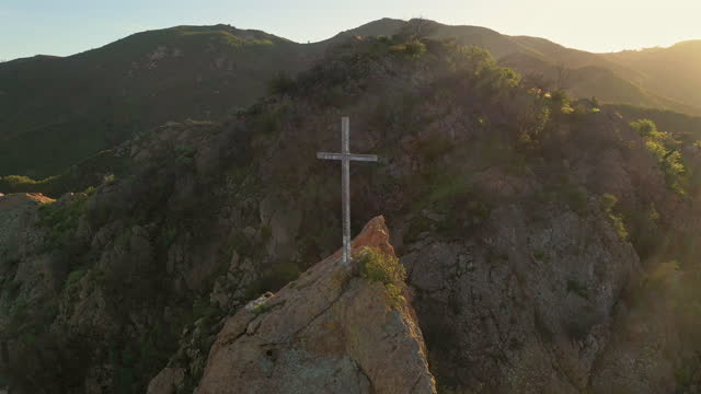 Wooden cross in the Santa Monica mountains in golden afternoon sunlight