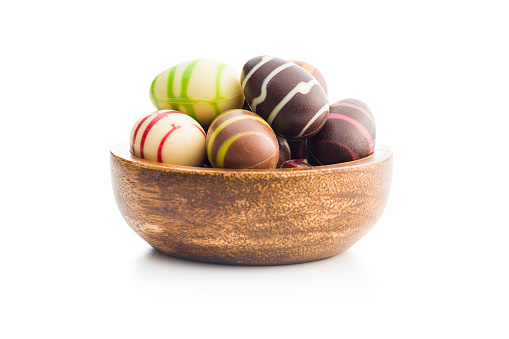 Chocolate easter eggs in bowl isolated on the white background.