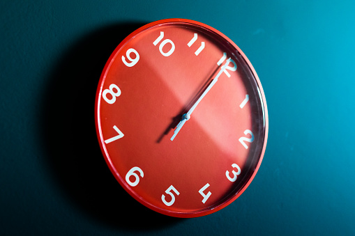 Red Clock on the Sea Wall