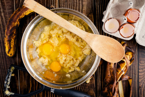 istock Mashed Bananas and Eggs in a Mixing Bowl with a Wooden Spoon 1479508541