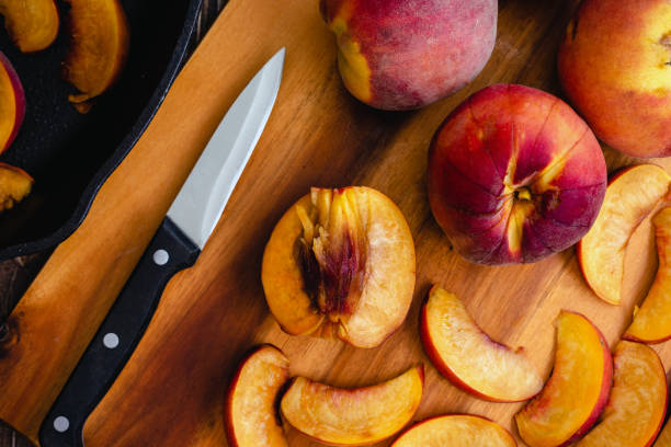istock Sliced Fresh Peaches on a Wood Cutting Board 1479508974