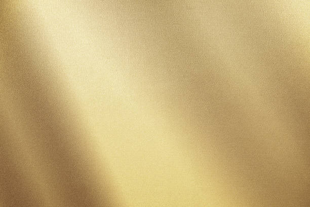 淡い茶色の黄色のシルクサテン。勾配。ほこりっぽい金色。金色の高級優雅な抽象的背景。 - 金色 ストックフォトと画像