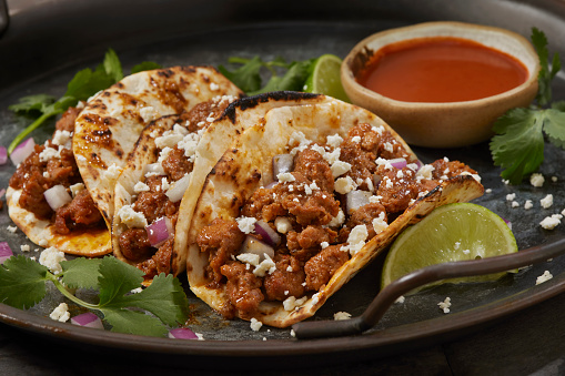 Spicy Chorizo Tacos in Corn Tortillas with Red Onion, Cilantro and Cotija Cheese