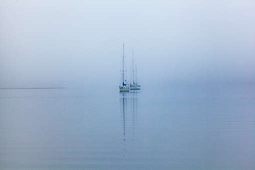 Sailing in the dense fog in Atlantic ocean near Bass Harbor, Maine, USA
