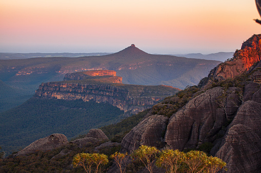 Sunrise over dramatic mountain landscape scene, South East Coast, Australia. Pigeon house mountain in the Budawang Mountain Range.