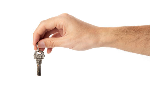 istock The keys are in a man's hand on a white background. 1479518203