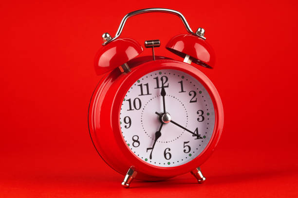 istock Red alarm clock on a red background. 1479518484