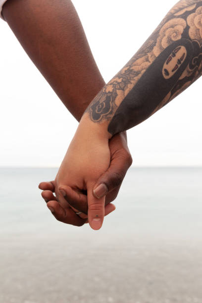 Holding hands stock photo