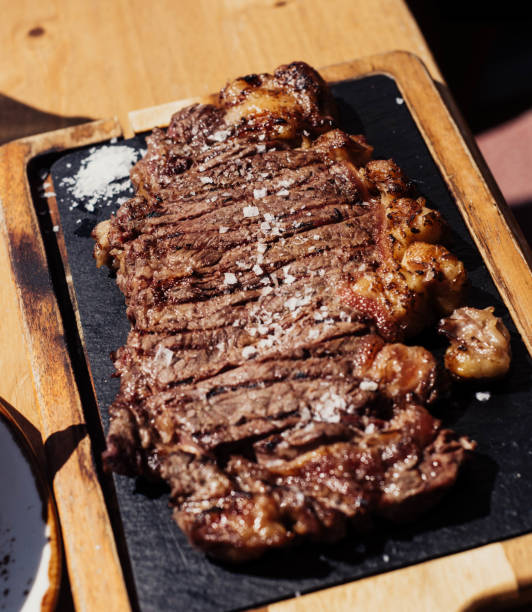 istock Grilled ribeye steak on wooden board 1479520586