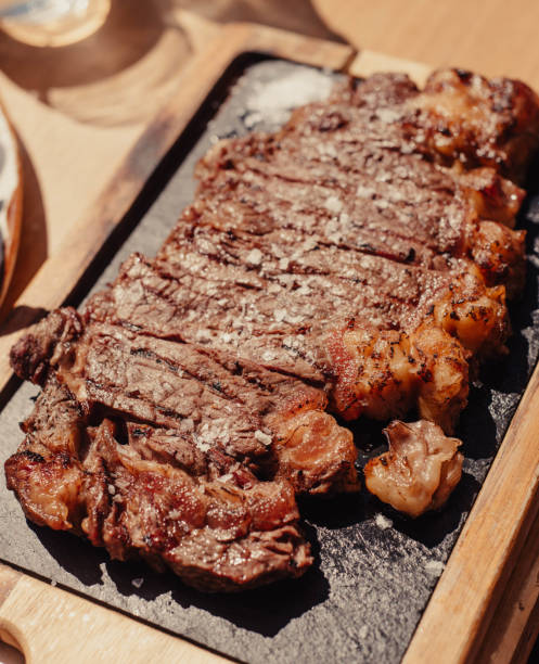 istock Grilled ribeye steak on wooden board 1479520605