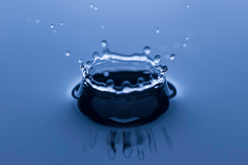 Bubble soda and blue oxygen air, in underwater clear liquid with bubbles flowing up on the water surface, isolated on a white background