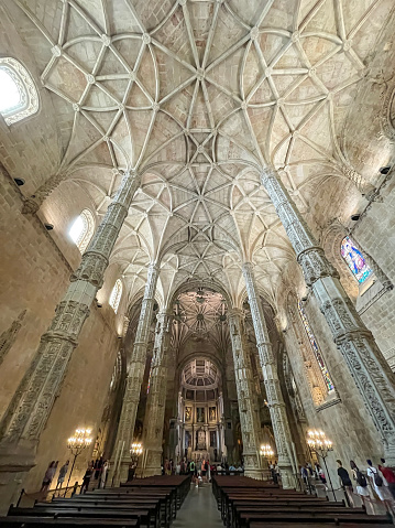 wide angle view of the interior of the Church of Monastery of Jeronimos (Mosteiro dos Jeronimos), manueline style, in Belem, Lisbon, Portugal, vertical