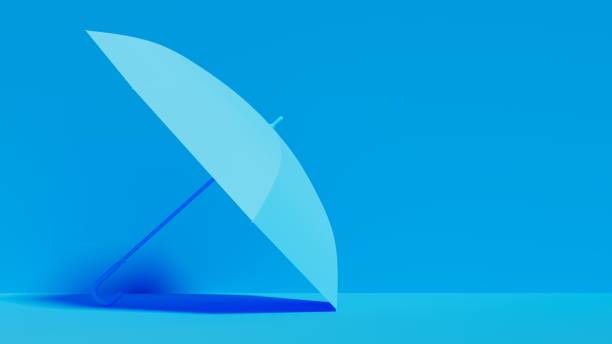 Blue umbrella tilted on the floor in blue setting, usable for creativity themes